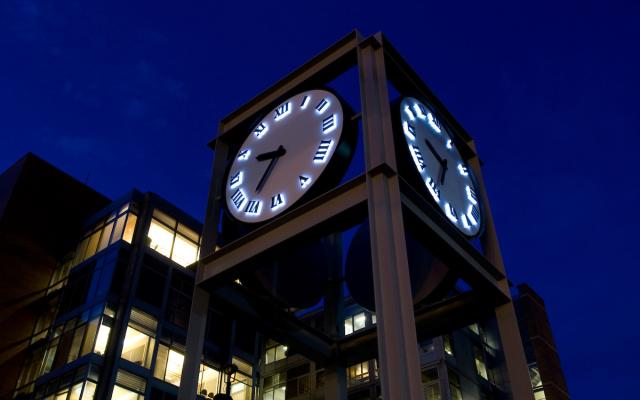 Clock Tower in Urban Plaza at night