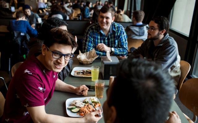 Students sharing a meal in Victor's Dining Hall