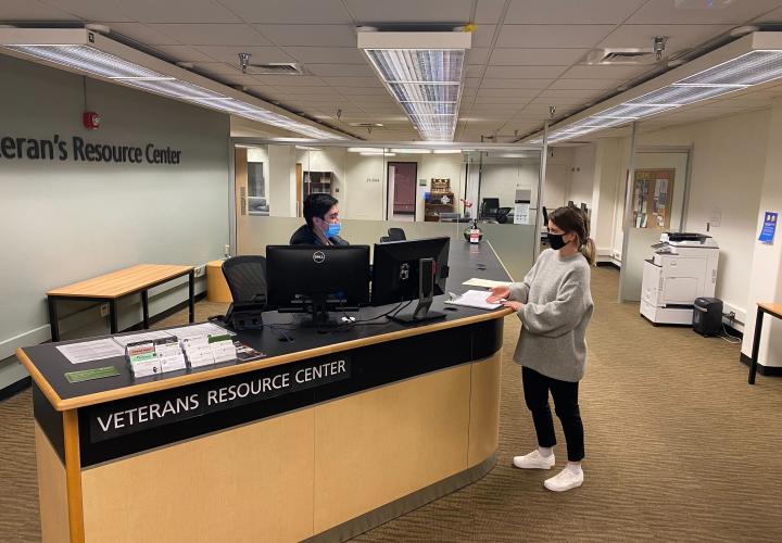 Students at front desk of Veterans Resource Center